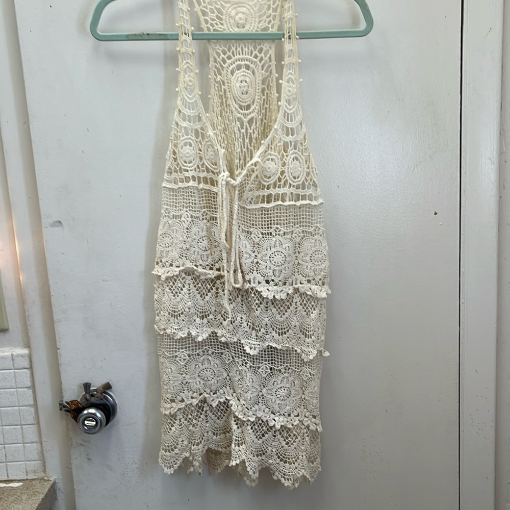 Cream colored lace bathing suit cover up. Size Small.
